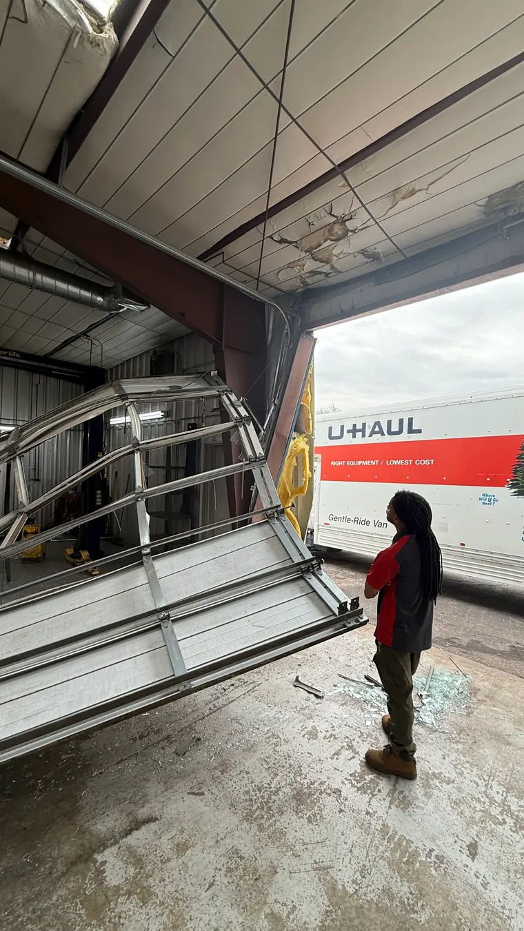 Damaged commercial storefront before
